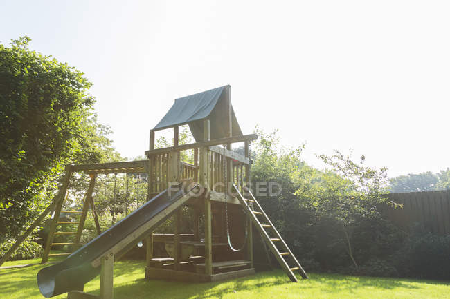 Play structure in backyard over grass — Stock Photo