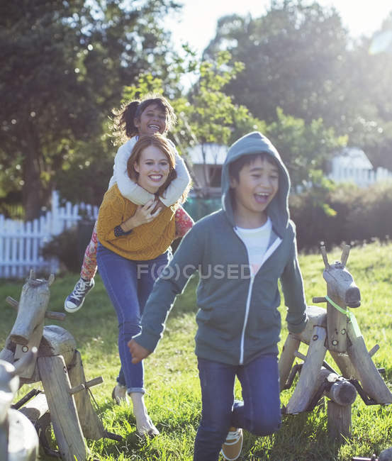 Students and teacher walking outdoors — Stock Photo