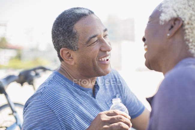 Senior couple laughing outdoors — Stock Photo