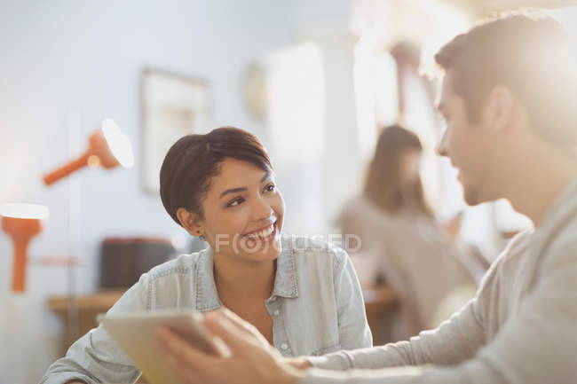 Young couple using digital tablet — Stock Photo
