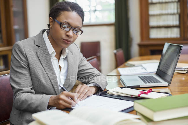 Lawyer taking notes in chambers — Stock Photo