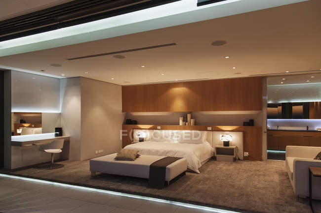 Cozy bedroom in modern house interior — Stock Photo