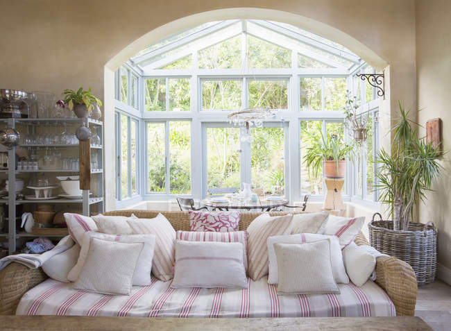 Shabby chic living room and sunroom — Stock Photo