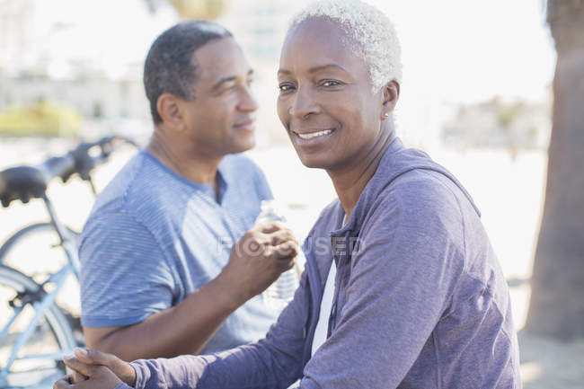 Portrait of smiling couple outdoors — Stock Photo