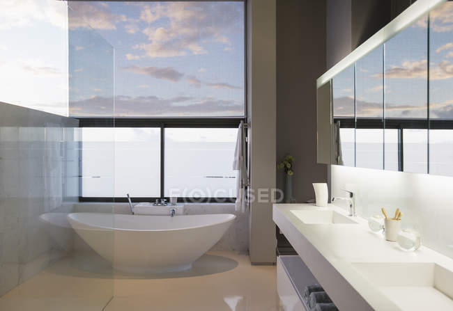 Luxury interior of house, soaking tub in modern bathroom — Stock Photo