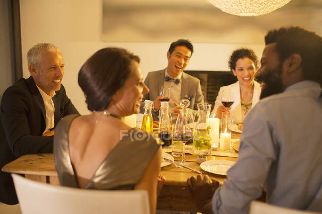 Friends talking at dinner party — Stock Photo