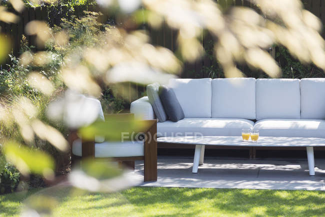 Sofa and armchair in backyard — Stock Photo