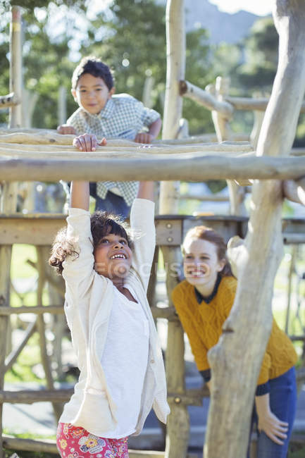 Teachers and students playing on play structure — Stock Photo