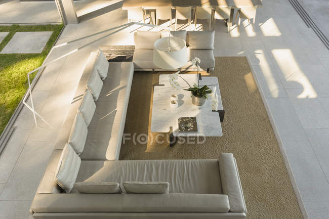Elevated view sectional sofa in modern, luxury home showcase interior living room — Stock Photo