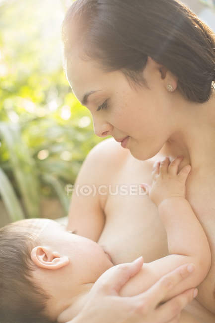 Mother breast-feeding baby boy — Stock Photo