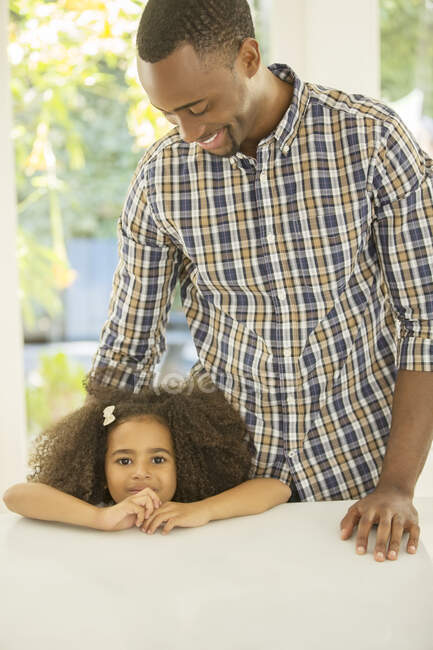 Portrait of smiling girl with father — Stock Photo
