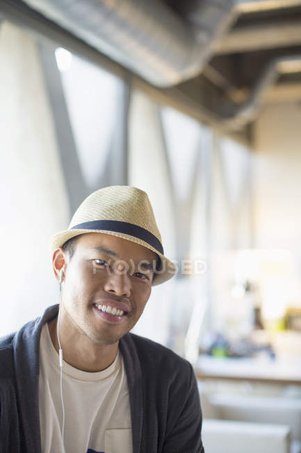 Portrait of smiling casual businessman at modern office — Stock Photo