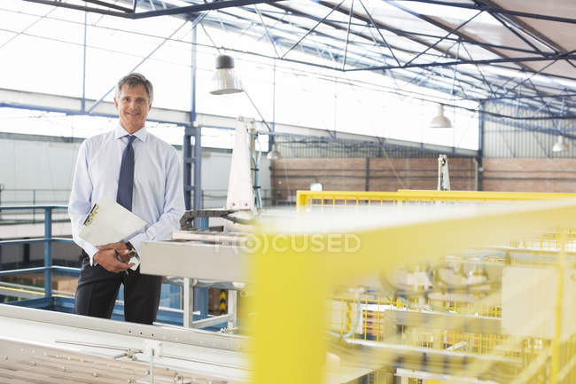 Portrait of supervisor in food processing plant — Stock Photo