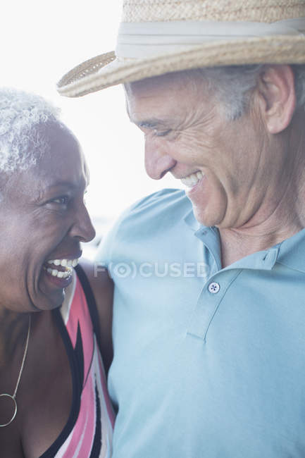 Close up of happy multiracial couple hugging — Stock Photo