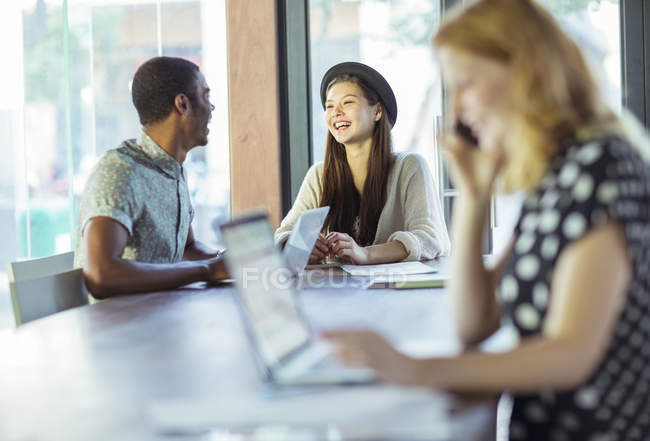 People working at conference table in office — Stock Photo