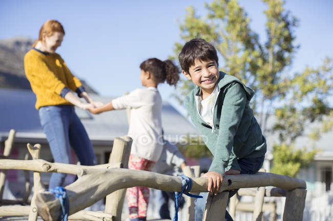 Teacher and students playing outdoors — Stock Photo