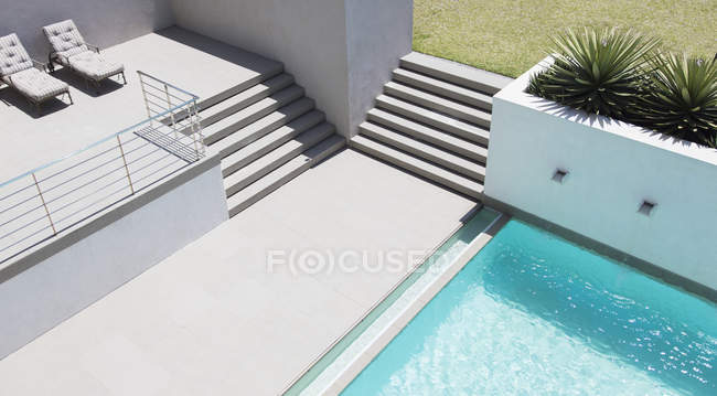 Modern patio with swimming pool — Stock Photo