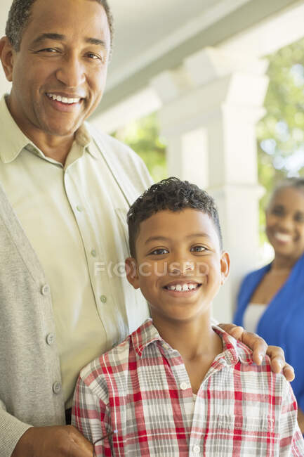 Close up portrait of grandfather and grandson — Stock Photo