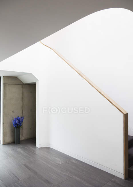 Painting along staircase of modern house — Stock Photo