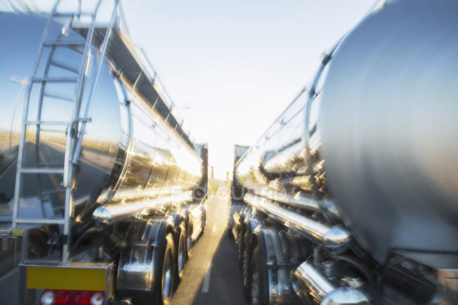 Stainless steel milk tankers side by side — Stock Photo