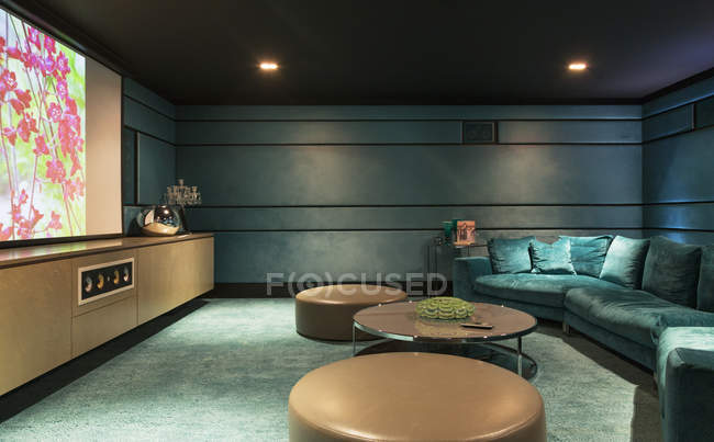 Sofa and tables in home movie theater — Stock Photo