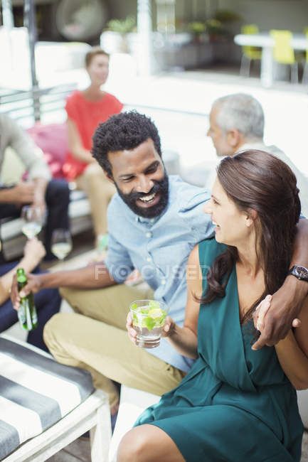 Couple hugging at party outdoors — Stock Photo