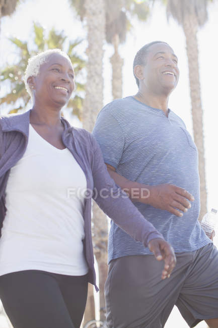 Senior couple power walking outdoors — Stock Photo