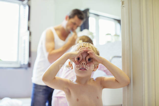 Boy making face in bathroom — Stock Photo