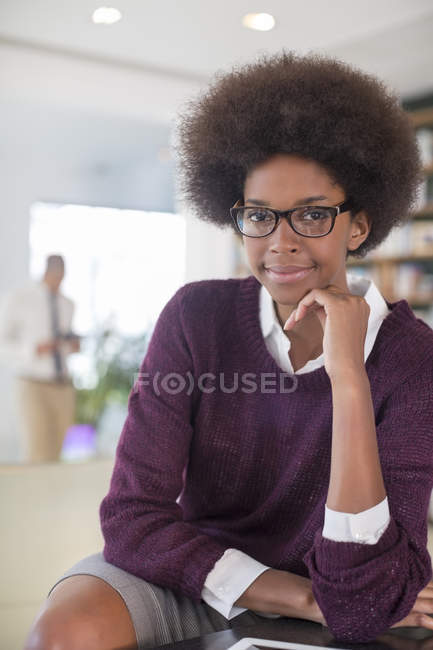 Businesswoman smiling in living room at home — Stock Photo
