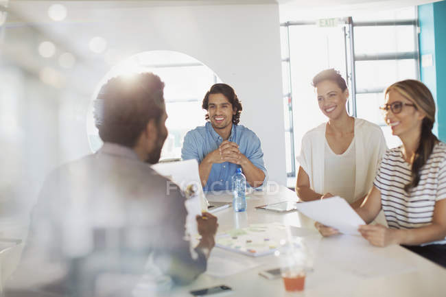 Smiling creative business people brainstorming, planning in conference room meeting — Stock Photo