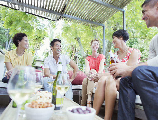 Friends talking at party — Stock Photo