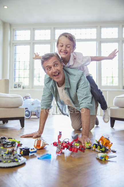 Father and son playing together — Stock Photo