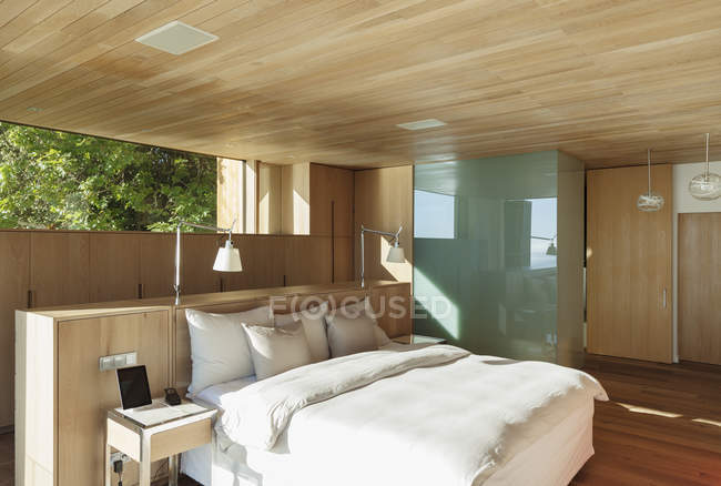 Sunny modern bedroom indoors — Stock Photo