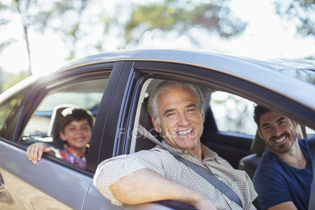 Portrait of multi-generation men inside car — Stock Photo