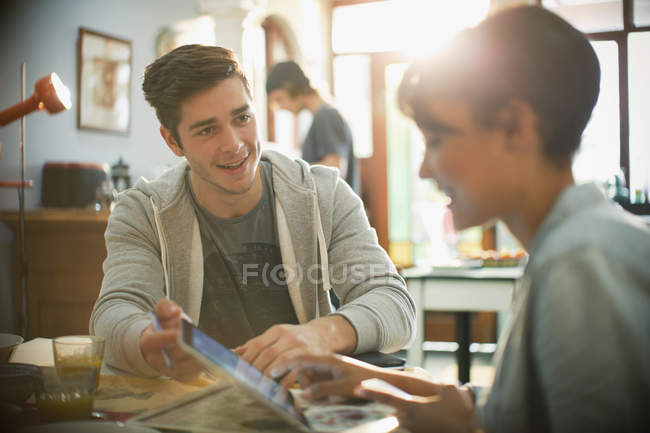 Young couple college students using digital tablet — Stock Photo