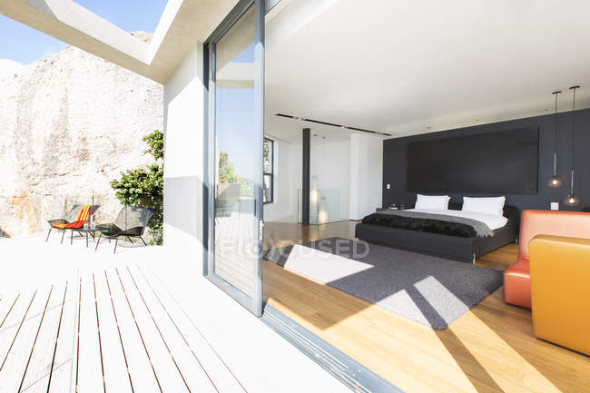Sliding glass door onto bedroom in modern house — Stock Photo