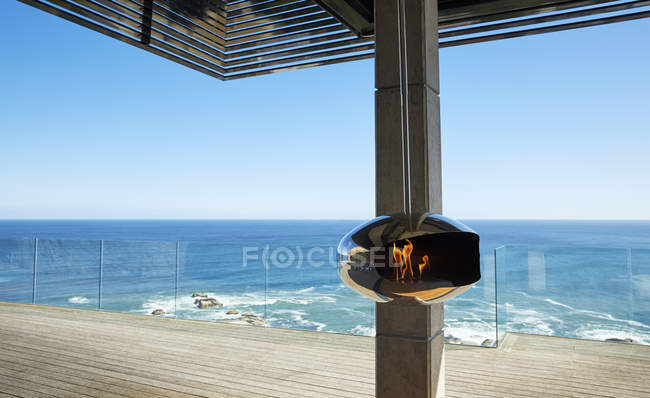 Luxury modern house  against sea water — Stock Photo