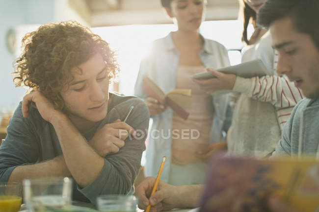 College students studying together at home — Stock Photo