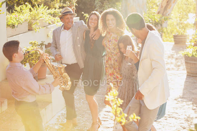 Family dancing together outdoors — Stock Photo