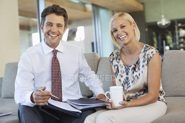 Business people talking on sofa — Stock Photo