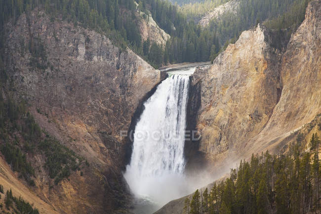 Aerial view of waterfall in rocky canyon — Stock Photo