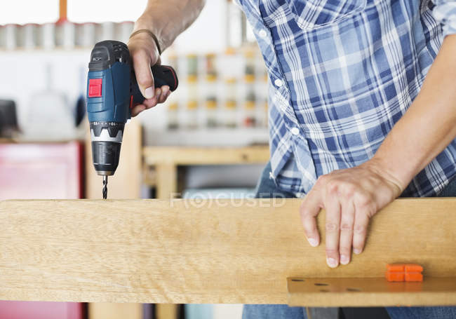Cropped image of man working in workshop — Stock Photo