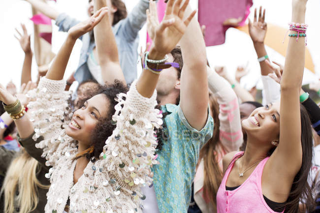 Fans cheering at music festival — Stock Photo