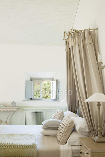 Luxury taupe bedroom indoors during daytime — Stock Photo