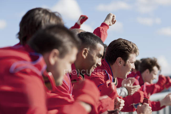 Race team watching from sidelines — Stock Photo