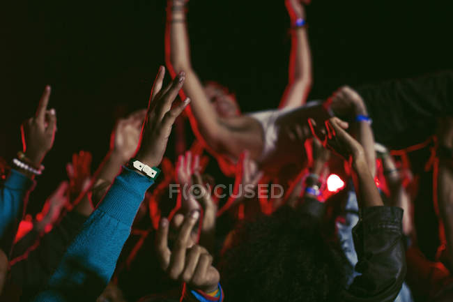Man crowd surfing at music festival — Stock Photo