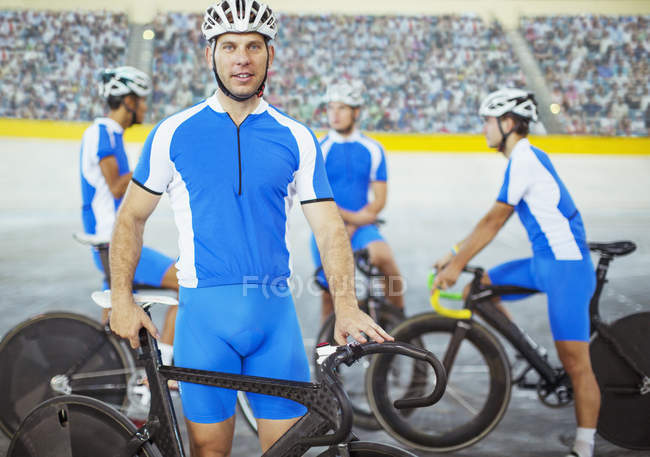 Track cyclists standing in velodrome — Stock Photo