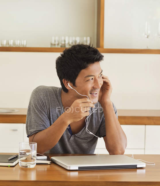 Young attractive Man wearing headset at table — Stock Photo