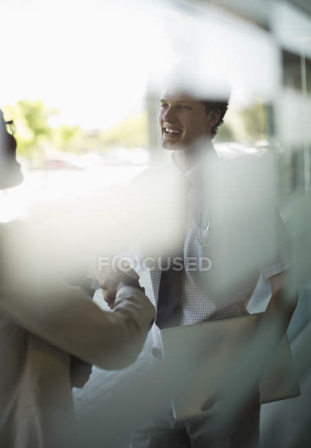 Business people shaking hands at modern office — Stock Photo