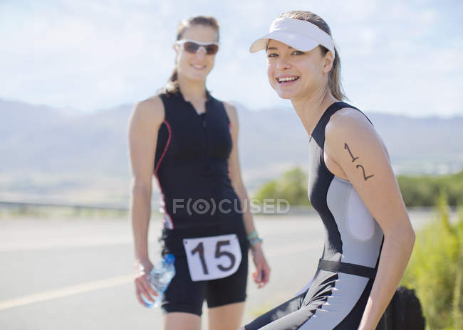 Runners smiling together outdoors — Stock Photo